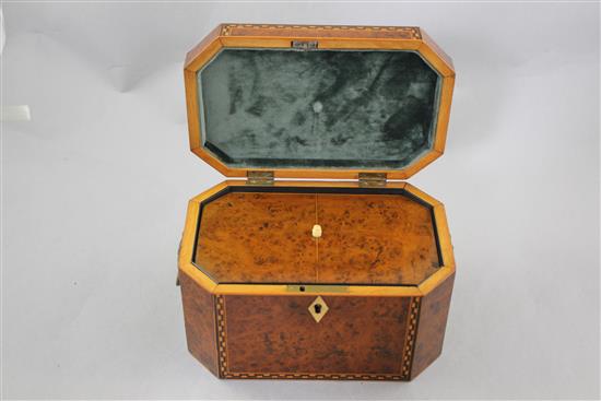 A Victorian birds eye yew elongated octagonal tea caddy, 8.5in.